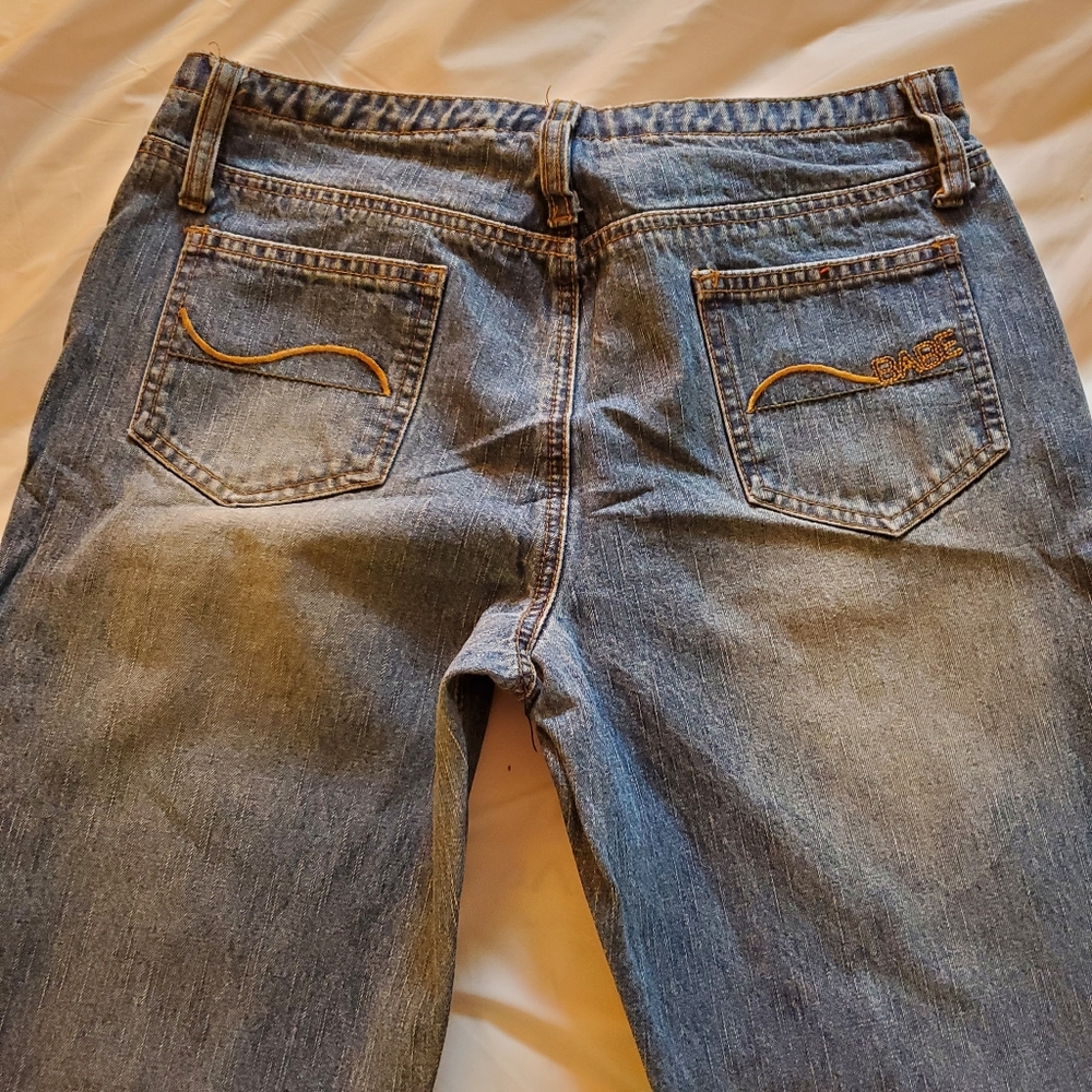 Sand washed blue jeans "Babe" on back pocket